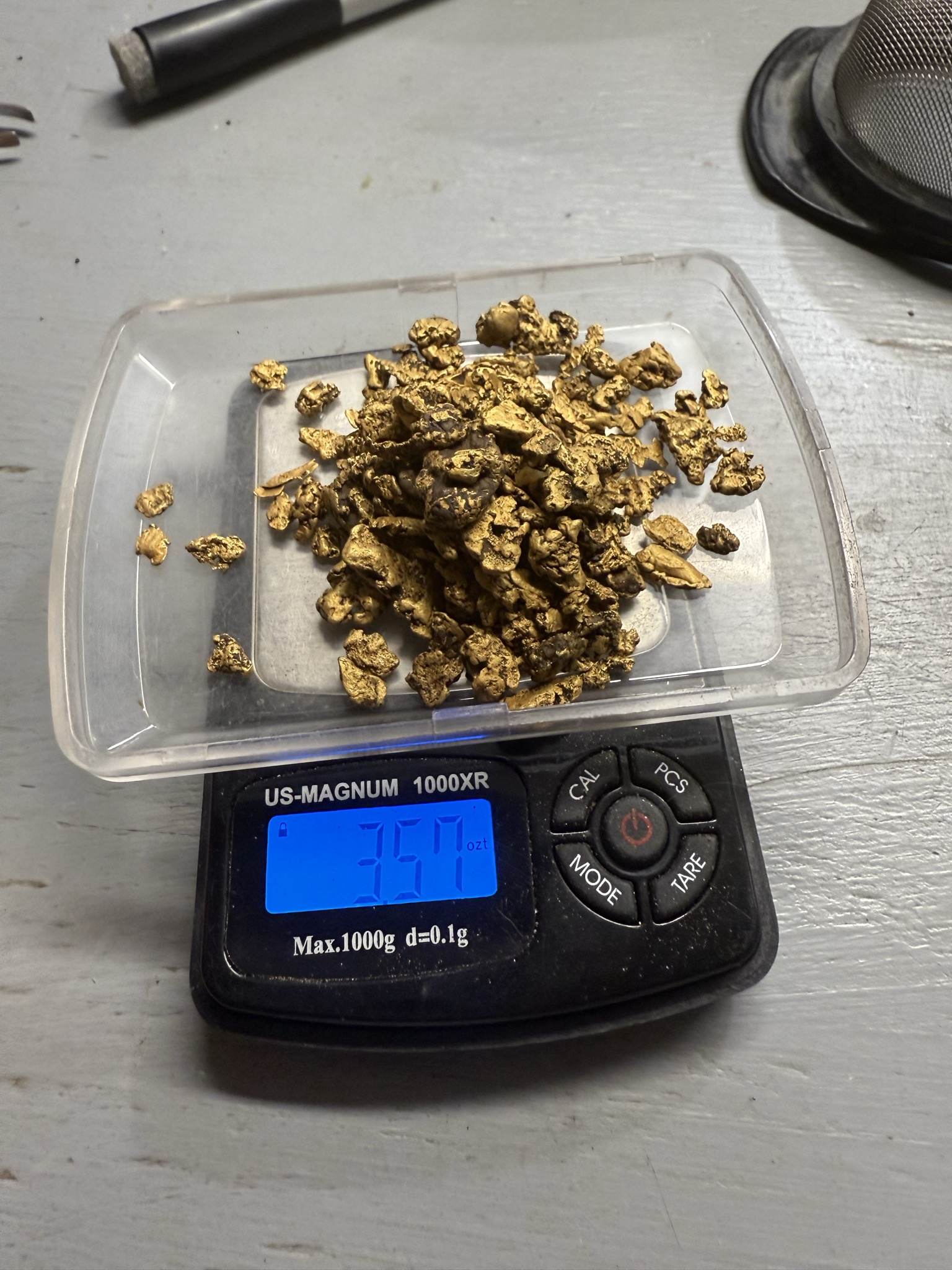 Larger gold nugget weigh-up on a digital scale.