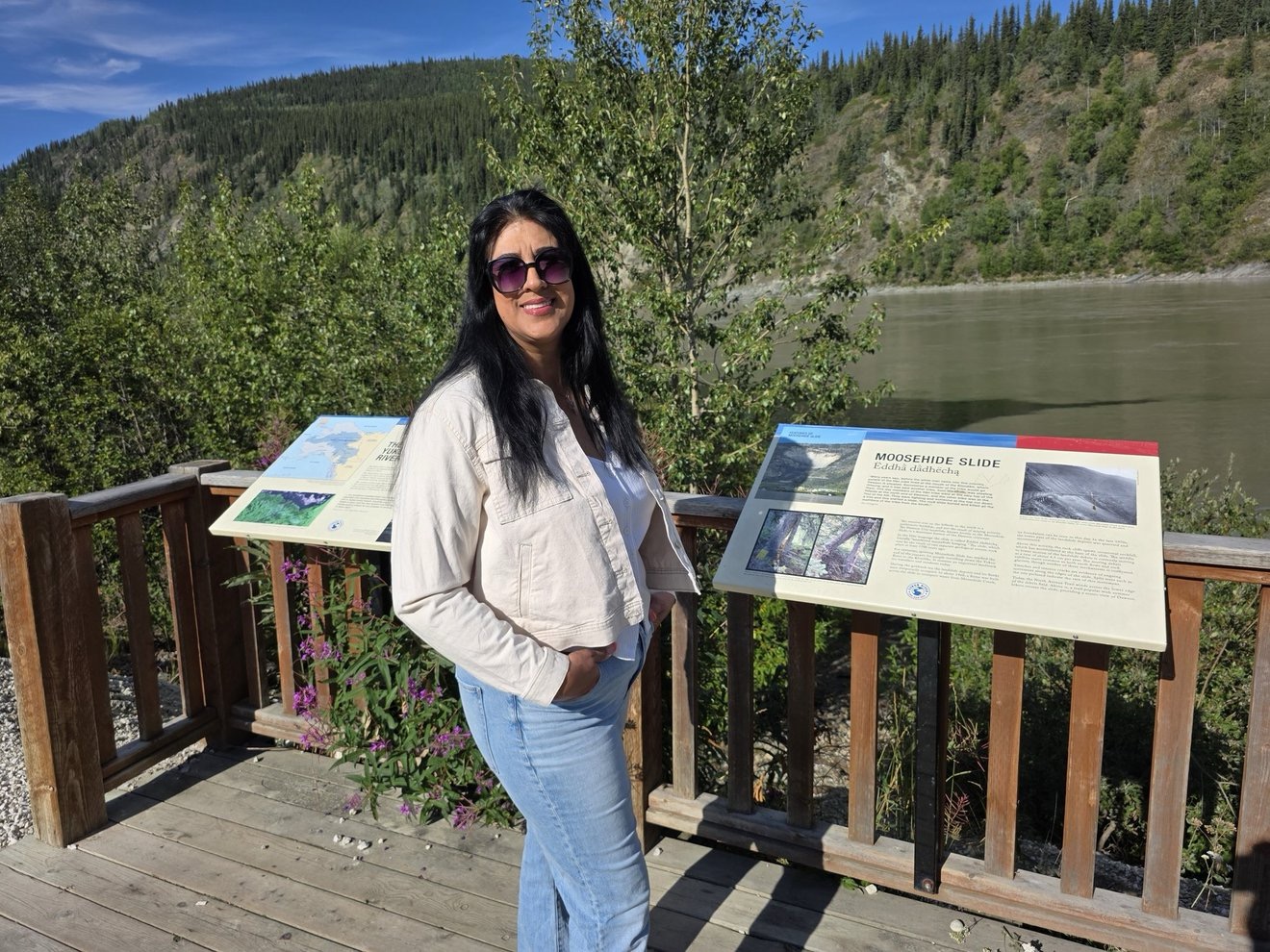Portrait at a mountain overlook deck.