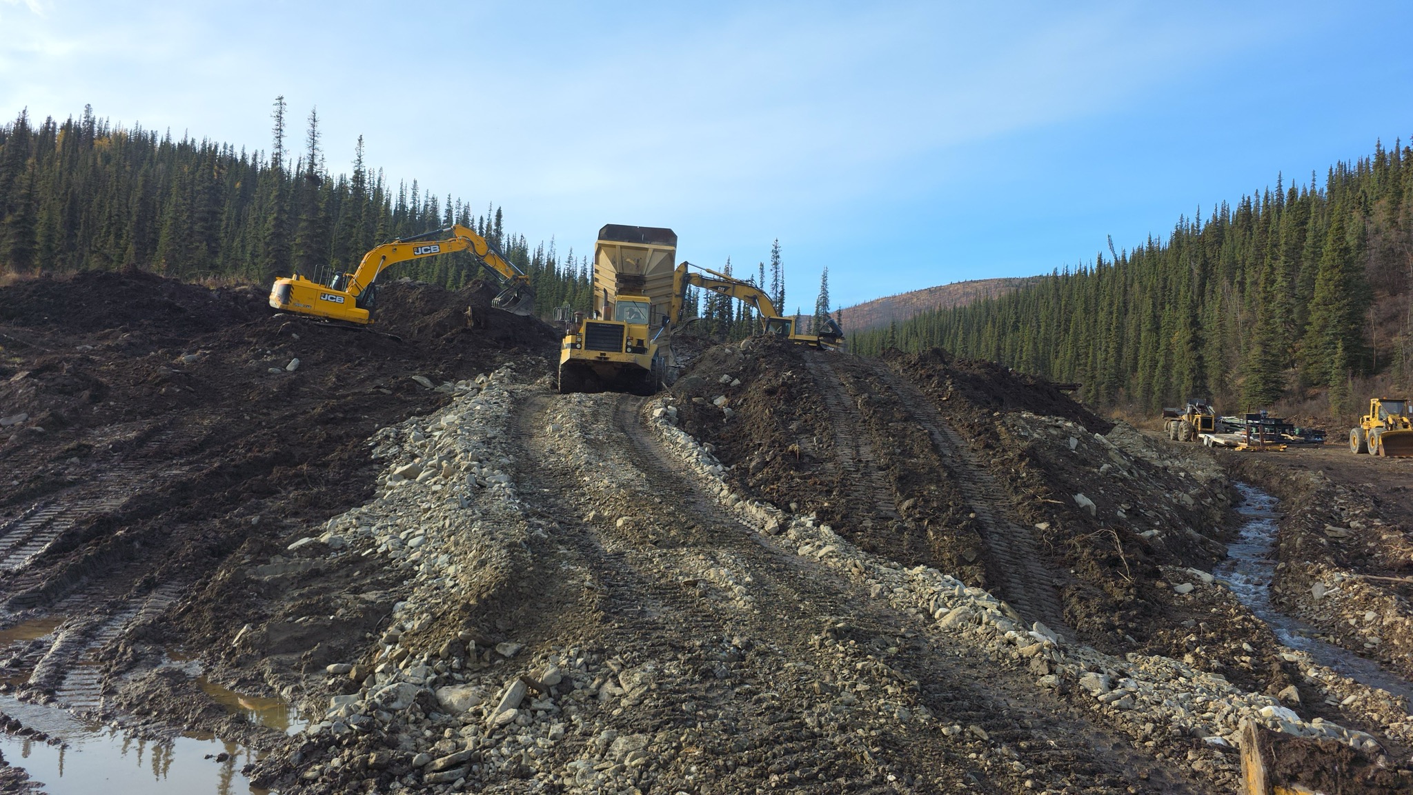 Wide panoramic view of the surface placer worksite.