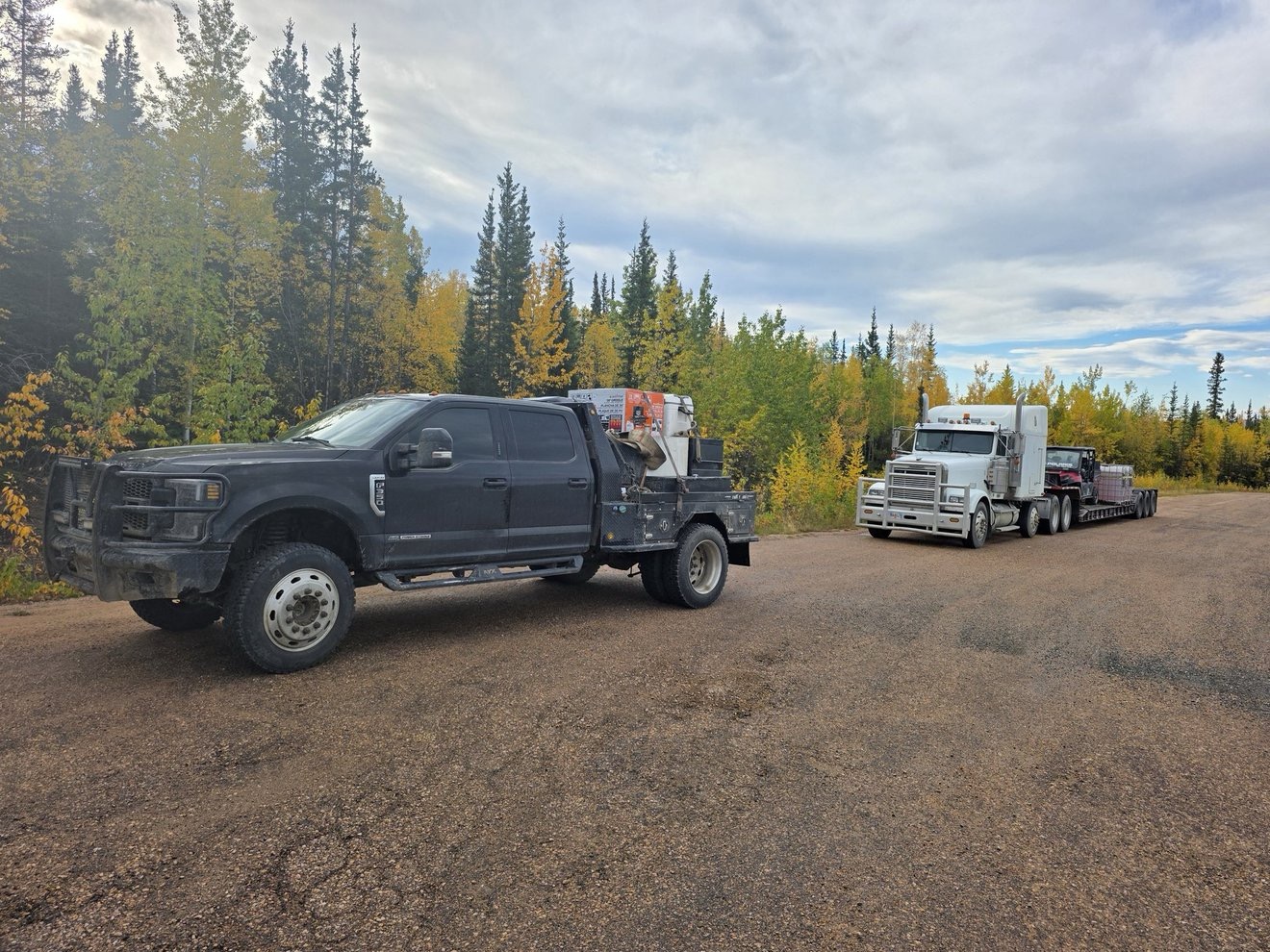 Trucks and equipment parked at camp.